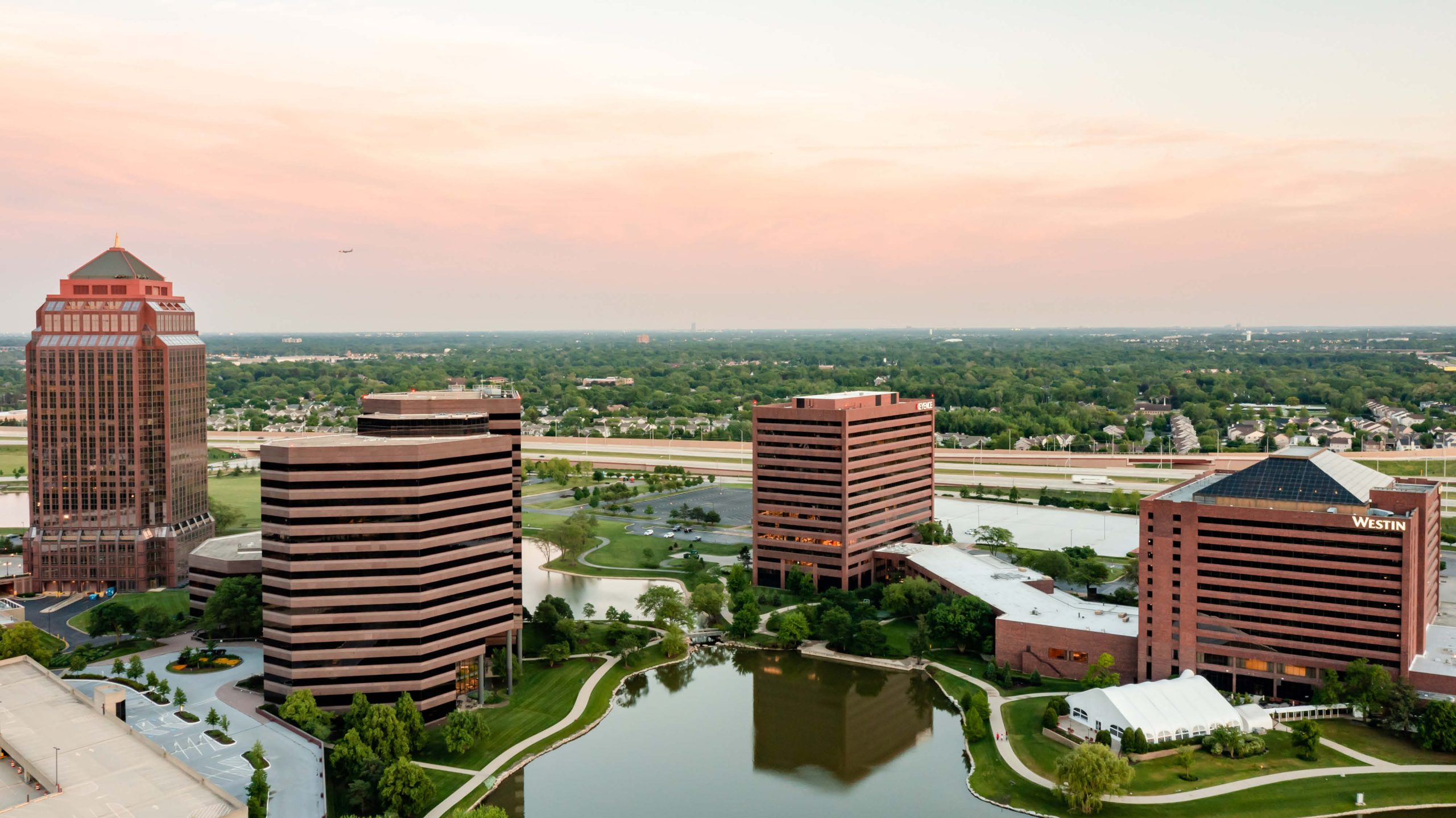 Hotel and other towers near a pond